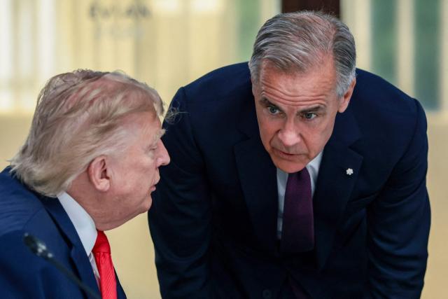 US President Donald Trump (L) and Canada’s Prime Minister Mark Carney (R) attend a work lunch as part of the G7 summit, in Evian, eastern France, on June 16, 2026. A G7 summit is set to take place June 15 to 17 in the French town of Evian-les-Bains near Switzerland and it will be attended by country leaders as well as the EU's foreign policy chief and ministers from Brazil, Canada, the United Arab Emirates and Turkey. (Photo by Evelyn Hockstein / POOL / AFP)