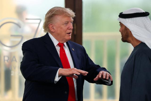 US President Donald Trump (L) and UAE's President Sheikh Mohamed bin Zayed al-Nahyan attend a work lunch as part of the G7 summit, in Evian, eastern France, on June 16, 2026. A G7 summit is set to take place June 15 to 17 in the French town of Evian-les-Bains near Switzerland and it will be attended by country leaders as well as the EU's foreign policy chief and ministers from Brazil, Canada, the United Arab Emirates and Turkey. (Photo by Christian Hartmann / POOL / AFP)