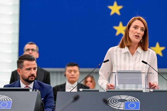 EU Parliament President Roberta Metsola (R) introduces President of Montenegro Jakov Milatovic (L) during a plenary session at the European Parliament in Strasbourg, eastern France, on June 16, 2026. (Photo by Jean-Christophe VERHAEGEN / AFP)