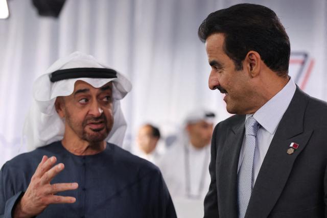 Qatar's Emir Sheikh Tamim bin Hamad al-Thani (R) and UAE's President Sheikh Mohamed bin Zayed al-Nahyan attend a work lunch as part of the G7 summit, in Evian, eastern France, on June 16, 2026. A G7 summit is set to take place June 15 to 17 in the French town of Evian-les-Bains near Switzerland and it will be attended by country leaders as well as the EU's foreign policy chief and ministers from Brazil, Canada, the United Arab Emirates and Turkey. (Photo by Christian Hartmann / POOL / AFP)