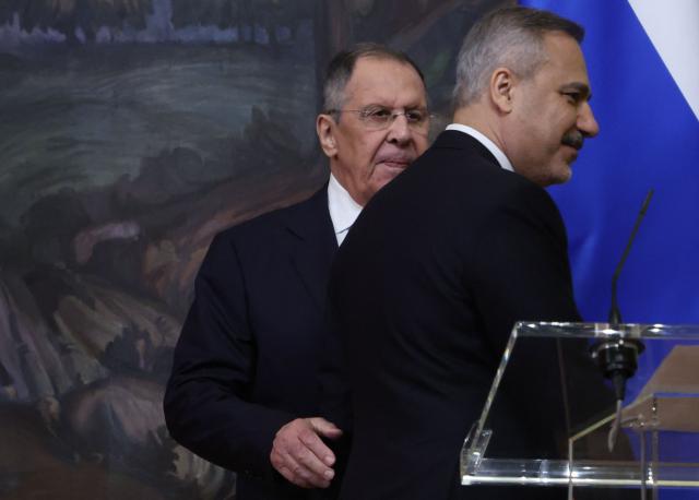 Russian Foreign Minister Sergei Lavrov and his Turkish counterpart Hakan Fidan leave a joint press conference following their meeting in Moscow on June 16, 2026. (Photo by SERGEI ILNITSKY / POOL / AFP)