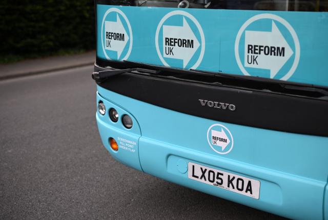 A poster for the Reform UK party, is pictured in the political party's campaign bus, in Makerfield, north-west England on June 16, 2026, ahead of the forthcoming by-election on June 18. Britain holds a special vote on June 18 that is expected to set in motion an attempt to oust Labour leader Keir Starmer as prime minister. (Photo by Oli SCARFF / AFP)