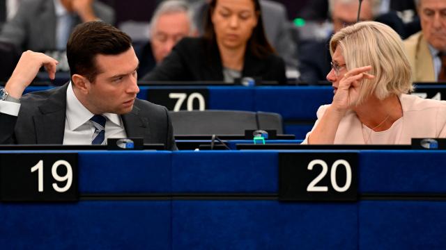 French far-right Rassemblement National (RN) party's President, Member of the European Parliament and president of the Patriots for Europe group Jordan Bardella (L) speaks with  Hungarian MEP and vice-president of the Patriots for Europe group Kinga Gal during a plenary session at the European Parliament in Strasbourg on June 16, 2026. (Photo by Jean-Christophe VERHAEGEN / AFP)