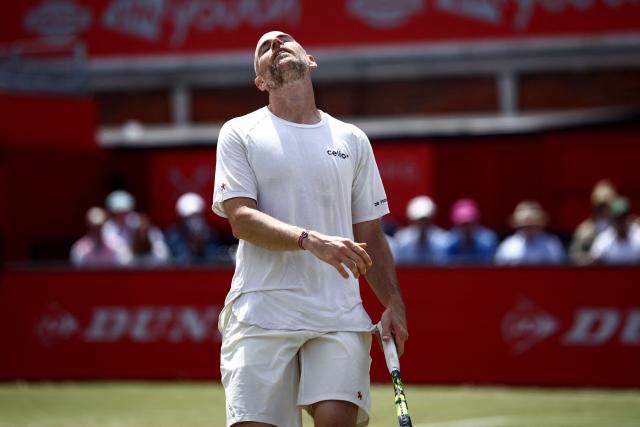 France's Adrian Mannarino reacts whilst playing against Czech Republic's Jakub Mensik during their men's singles round of 32 tennis match on day two of the ATP HSBC Championships at Queen's Club in west London on June 16, 2026. (Photo by Henry NICHOLLS / AFP)