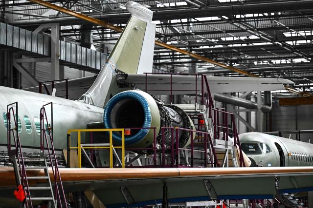 This photograph shows Falcon 6X business aircrafts on an assembly line at the Dassault Aviation plant in Merignac, southwestern France on June 16, 2026. (Photo by Christophe ARCHAMBAULT / AFP)