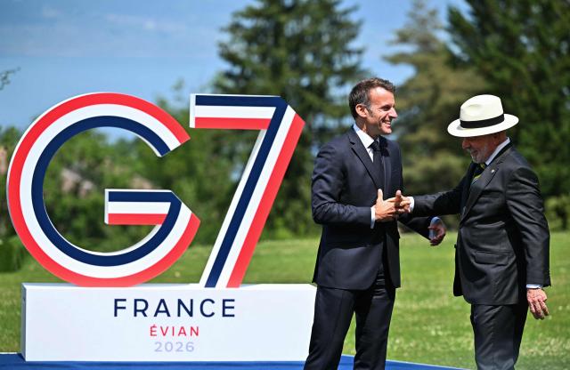 France's President Emmanuel Macron welcomes Brazil's President Luiz Inacio Lula da Silva for the official greeting during the G7 summit, in Evian, eastern France, on June 16, 2026. A G7 summit is set to take place June 15 to 17 in the French town of Evian-les-Bains near Switzerland and it will be attended by country leaders as well as the EU's foreign policy chief and ministers from Brazil, Canada, the United Arab Emirates and Turkey. (Photo by Mandel NGAN / AFP)