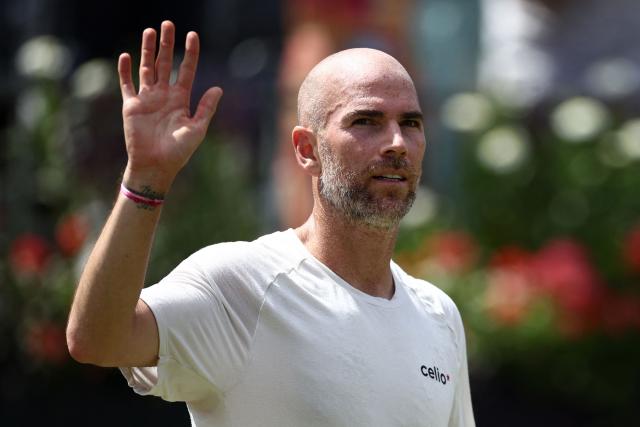 France's Adrian Mannarino celebrates winning against Czech Republic's Jakub Mensik during their men's singles round of 32 tennis match on day two of the ATP HSBC Championships at Queen's Club in west London on June 16, 2026. (Photo by Henry Nicholls / AFP)