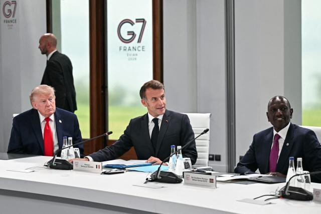 US President Donald Trump, France's President Emmanuel Macron and Kenya's President William Ruto attend a work meeting as part of the G7 summit, in Evian, eastern France, on June 16, 2026. A G7 summit is set to take place June 15 to 17 in the French town of Evian-les-Bains near Switzerland and it will be attended by country leaders as well as the EU's foreign policy chief and ministers from Brazil, Canada, the United Arab Emirates and Turkey. (Photo by Mandel NGAN / AFP)