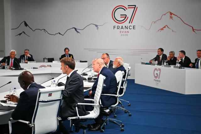 (From 2L) France's President Emmanuel Macron, US President Donald Trump and India's Prime Minister Narendra Modi attend a work meeting as part of the G7 summit, in Evian, eastern France, on June 16, 2026. A G7 summit is set to take place June 15 to 17 in the French town of Evian-les-Bains near Switzerland and it will be attended by country leaders as well as the EU's foreign policy chief and ministers from Brazil, Canada, the United Arab Emirates and Turkey. (Photo by Mandel NGAN / AFP)
