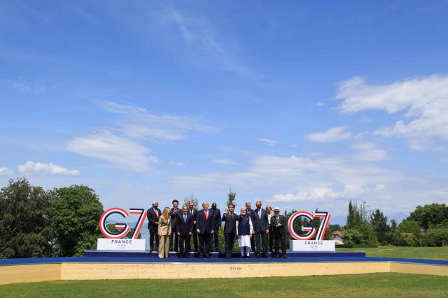 (From L) European Council President Antonio Costa, Italy's Prime Minister Giorgia Meloni, South Korea's President Lee Jae-myung, Egypt's President Abdel Fattah El-Sisi, Britain's Prime Minister Keir Starmer, US President Donald Trump, Kenya's President William Ruto, France's President Emmanuel Macron, Japan's Prime Minister Sanae Takaichi, India's Prime Minister Narendra Modi, Canada's Prime Minister Mark Carney, Germany's Chancellor Friedrich Merz, European Commission President Ursula von der Leyen and Brazilian politician Luiz Inacio Lula Da Silva pose for a family photograph during the G7 summit, in Evian, eastern France, on June 16, 2026. A G7 summit is set to take place June 15 to 17 in the French town of Evian-les-Bains near Switzerland and it will be attended by country leaders as well as the EU's foreign policy chief and ministers from Brazil, Canada, the United Arab Emirates and Turkey. (Photo by Ludovic MARIN / POOL / AFP)
