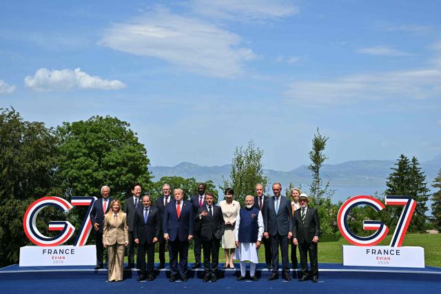 (From L) European Council President Antonio Costa, Italy's Prime Minister Giorgia Meloni, South Korea's President Lee Jae-myung, Egypt's President Abdel Fattah El-Sisi, Britain's Prime Minister Keir Starmer, US President Donald Trump, Kenya's President William Ruto, France's President Emmanuel Macron, Japan's Prime Minister Sanae Takaichi, India's Prime Minister Narendra Modi, Canada's Prime Minister Mark Carney, Germany's Chancellor Friedrich Merz, European Commission President Ursula von der Leyen and Brazilian politician Luiz Inacio Lula Da Silva pose for a family photograph during the G7 summit, in Evian, eastern France, on June 16, 2026. A G7 summit is set to take place June 15 to 17 in the French town of Evian-les-Bains near Switzerland and it will be attended by country leaders as well as the EU's foreign policy chief and ministers from Brazil, Canada, the United Arab Emirates and Turkey. (Photo by Mandel NGAN / AFP)