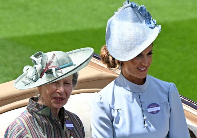 Britain's Princess Anne, Princess Royal (L) and Harriet Sperling arrive by horse-drawn carriage on the first day of the Royal Ascot horse racing meeting in Ascot, west of London, on June 16, 2026. (Photo by JUSTIN TALLIS / AFP)