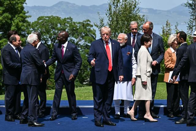 US President Donald Trump (C) poses for a family photograph during the G7 summit, in Evian, eastern France, on June 16, 2026. A G7 summit is set to take place June 15 to 17 in the French town of Evian-les-Bains near Switzerland and it will be attended by country leaders as well as the EU's foreign policy chief and ministers from Brazil, Canada, the United Arab Emirates and Turkey. (Photo by Mandel NGAN / AFP)