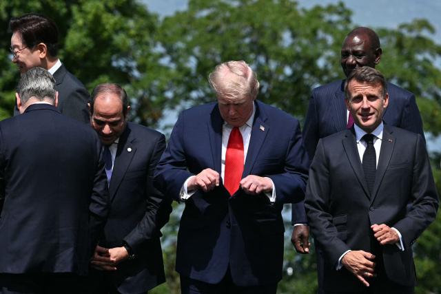 (From 2L) Egypt's President Abdel Fattah al-Sisi, US President Donald Trump, Kenya's President William Ruto and France's President Emmanuel Macron pose for a family photograph during the G7 summit, in Evian, eastern France, on June 16, 2026. A G7 summit is set to take place June 15 to 17 in the French town of Evian-les-Bains near Switzerland and it will be attended by country leaders as well as the EU's foreign policy chief and ministers from Brazil, Canada, the United Arab Emirates and Turkey. (Photo by Mandel NGAN / AFP)