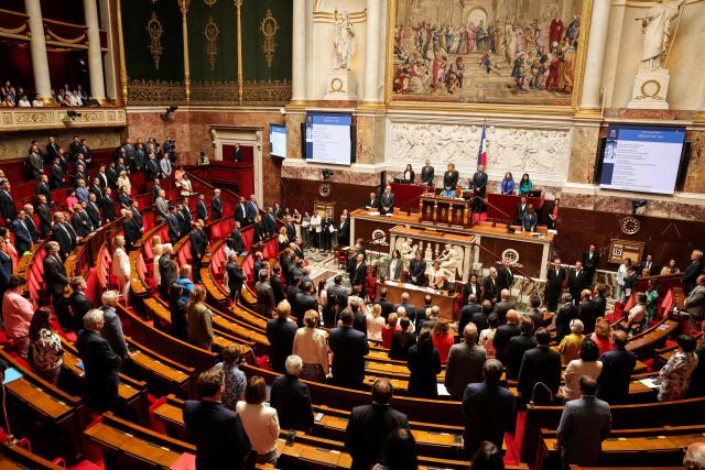 MPs and ministers respect a minute of silence, in tribute to a French soldier who died last week in Lebanon, at the start of a session of questions to the government at The National Assembly, France's lower house of parliament in Paris on June 16, 2026. Florian Gillet, a French soldier aged 21, deployed in Lebanon died on June 10, 2026 after being hit by an “accidental shot whilst preparing for a training exercise”, the Chief of the Army Staff announced in a post on X. (Photo by Thomas SAMSON / AFP)