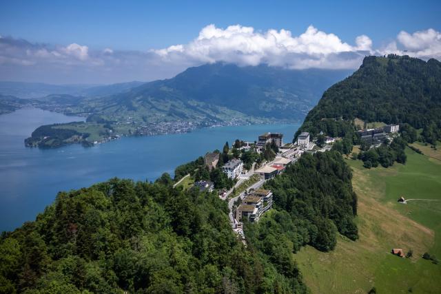 (FILES) This aerial photograph taken on June 4, 2024, shows the Burgenstock resort above Lake Lucerne that will host a Ukraine peace summit on June 15-16, 2024. A US-Iran deal aimed at ending the Middle East war will be signed at Switzerland's mountainside Burgenstock resort on June 19, 2026, the Swiss foreign ministry confirmed to AFP. The site, located near Lucerne in central Switzerland, is difficult to access and therefore easily secured. (Photo by Fabrice COFFRINI / AFP)