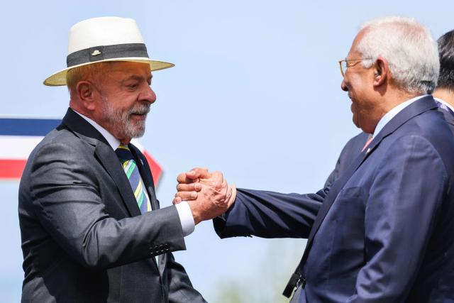 Brazil's President Luiz Inacio Lula da Silva greets European Council President Antonio Costa during a family photograph as part of the G7 summit, in Evian, eastern France, on June 16, 2026. A G7 summit is set to take place June 15 to 17 in the French town of Evian-les-Bains near Switzerland and it will be attended by country leaders as well as the EU's foreign policy chief and ministers from Brazil, Canada, the United Arab Emirates and Turkey. (Photo by Ludovic MARIN / POOL / AFP)