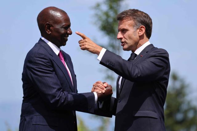 France's President Emmanuel Macron welcomes Kenya's President William Ruto (L) for the official greeting ahead of a work lunch as part of the G7 summit, in Evian, eastern France, on June 16, 2026. A G7 summit is set to take place June 15 to 17 in the French town of Evian-les-Bains near Switzerland and it will be attended by country leaders as well as the EU's foreign policy chief and ministers from Brazil, Canada, the United Arab Emirates and Turkey. (Photo by Ludovic MARIN / AFP)