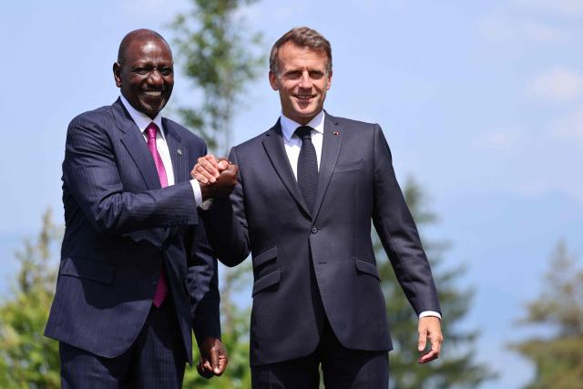 France's President Emmanuel Macron welcomes Kenya's President William Ruto (L) for the official greeting ahead of a work lunch as part of the G7 summit, in Evian, eastern France, on June 16, 2026. A G7 summit is set to take place June 15 to 17 in the French town of Evian-les-Bains near Switzerland and it will be attended by country leaders as well as the EU's foreign policy chief and ministers from Brazil, Canada, the United Arab Emirates and Turkey. (Photo by Ludovic MARIN / AFP)