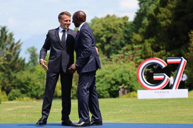 France's President Emmanuel Macron welcomes Kenya's President William Ruto (R) for the official greeting ahead of a work lunch as part of the G7 summit, in Evian, eastern France, on June 16, 2026. A G7 summit is set to take place June 15 to 17 in the French town of Evian-les-Bains near Switzerland and it will be attended by country leaders as well as the EU's foreign policy chief and ministers from Brazil, Canada, the United Arab Emirates and Turkey. (Photo by Ludovic MARIN / AFP)