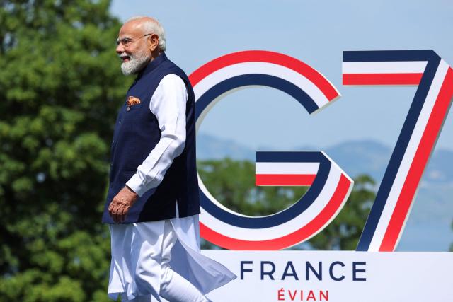 India's Prime Minister Narendra Modi arrives for the official greeting ahead of a work lunch as part of the G7 summit, in Evian, eastern France, on June 16, 2026. A G7 summit is set to take place June 15 to 17 in the French town of Evian-les-Bains near Switzerland and it will be attended by country leaders as well as the EU's foreign policy chief and ministers from Brazil, Canada, the United Arab Emirates and Turkey. (Photo by Ludovic MARIN / AFP)