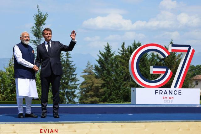 France's President Emmanuel Macron (R) welcomes India's Prime Minister Narendra Modi for the official greeting ahead of a work lunch as part of the G7 summit, in Evian, eastern France, on June 16, 2026. A G7 summit is set to take place June 15 to 17 in the French town of Evian-les-Bains near Switzerland and it will be attended by country leaders as well as the EU's foreign policy chief and ministers from Brazil, Canada, the United Arab Emirates and Turkey. (Photo by Ludovic MARIN / AFP)