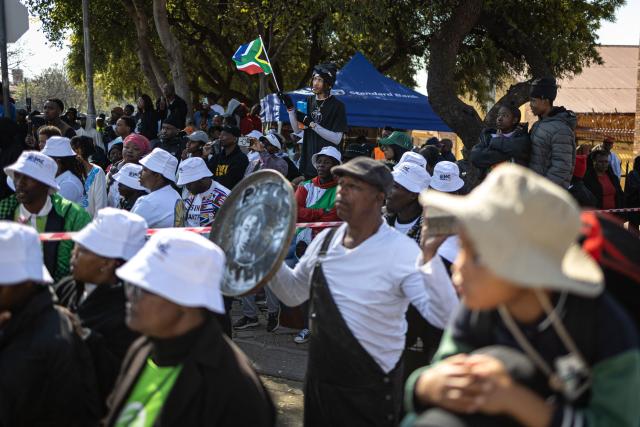 Attendees gather ahead of a march marking the 50th anniversary of the June 16, 1976 Soweto Uprising, organised by 1976 @ Fifty, in Soweto near Johannesburg, on June 16, 2026. June 16 is commemorated as Youth Day in South Africa, honouring the thousands of Black school students who took to the streets in 1976 to protest against the apartheid government’s imposition of Afrikaans as a language of instruction, and the students who were killed and injured when police opened fire on the demonstration. (Photo by EMMANUEL CROSET / AFP)