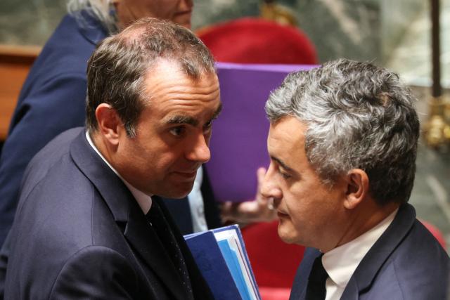 France's Prime Minister Sebastien Lecornu (L) speaks to France's Justice Minister Gerald Darmanin (R) during a session of questions to the government at The National Assembly, France's lower house of parliament in Paris on June 16, 2026. (Photo by Thomas SAMSON / AFP)