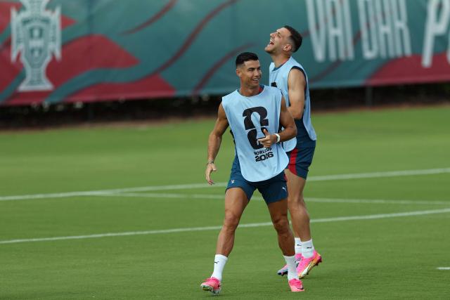 Portugal's forward #07 Cristiano Ronaldo (L) shares a laugh with Portugal's defender #05 Diogo Dalot during a training session at Gardens North County District Park in Palm Beach Gardens, Florida on June 16, 2026, on the eve of the 2026 World Cup Group K football match between Portugal and Congo DR. (Photo by PATRICIA DE MELO MOREIRA / AFP)