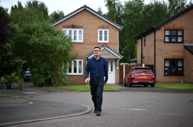 Andy Burnham, Labour's candidate in the forthcoming Makerfield by-election on June 18, canvasses voters in Hindley, north-west England on June 16, 2026. (Photo by Oli SCARFF / AFP)