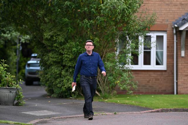 Andy Burnham, Labour's candidate in the forthcoming Makerfield by-election on June 18, canvasses voters in Hindley, north-west England on June 16, 2026. (Photo by Oli SCARFF / AFP)
