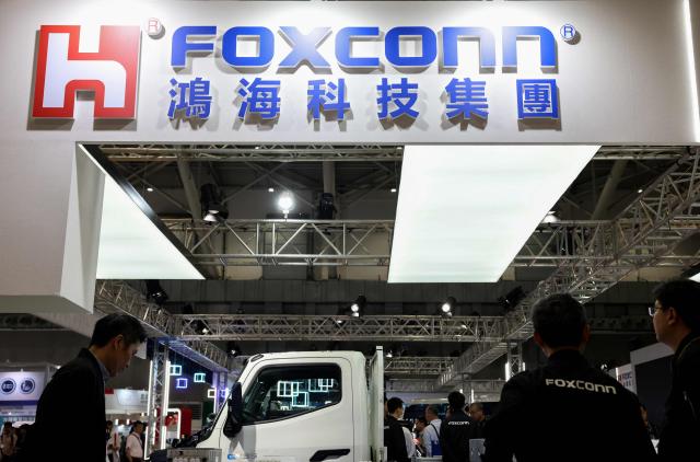 (FILES) The logo of Foxconn is seen during the AutoTronics Taipei 2026 at Nangang Exhibition Center in Taipei on April 15, 2026. Poland's Prime Minister Donald Tusk said on June 16, 2026 that its state-backed auto venture would partner with Taiwanese tech giant Foxconn to build hundreds of thousands of cars annually for the domestic and European market. Tusk said the government would finalise talks with Foxconn in the autumn to construct a hub in Jaworzno, southern Poland, "which will be integrated with the entire industrial and technological ecosystem". The Polish government will invest invest 4.5 billion zlotys (1.1 billion euros) in the venture, he added. (Photo by I-Hwa Cheng / AFP)