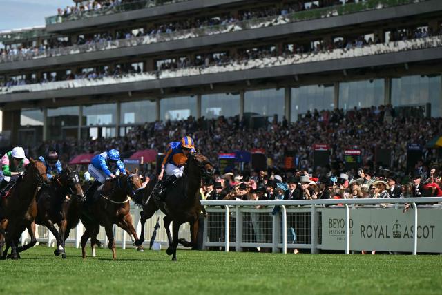 CORRECTION / Jockey Ryan Moore rides Mission Central (R) to win the King Charles III Stakes horse race on the first day of the Royal Ascot horse racing meeting in Ascot, west of London, on June 16, 2026. (Photo by JUSTIN TALLIS / AFP) / “The erroneous mention[s] appearing in the metadata of this photo by JUSTIN TALLIS has been modified in AFP systems in the following manner: [Jockey Ryan Moore] instead of [Jockey Aidan O'Brien]. Please immediately remove the erroneous mention[s] from all your online services and delete it (them) from your servers. If you have been authorized by AFP to distribute it (them) to third parties, please ensure that the same actions are carried out by them. Failure to promptly comply with these instructions will entail liability on your part for any continued or post notification usage. Therefore we thank you very much for all your attention and prompt action. We are sorry for the inconvenience this notification may cause and remain at your disposal for any further information you may require.”