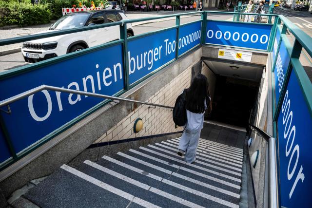 The Oranienburger Tor (Oranienburg Gate) underground station is decorated with a banner reading: "Oranienburger Toooooooor" with the word tor also meaning goal, in Berlin on June 16, 2026, after Germany played its first Football World Cup match. The banner campaign has involved every Berlin underground station that includes the word Tor in its name. (Photo by John MACDOUGALL / AFP)