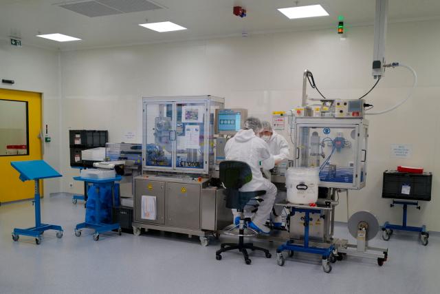 Employees work on a production line for clinical trials on a global scale during a press visit to the industrial site of the French pharmaceutical group Sanofi in Montpellier, southern France, on June 16, 2026. (Photo by Sylvain THOMAS / AFP)