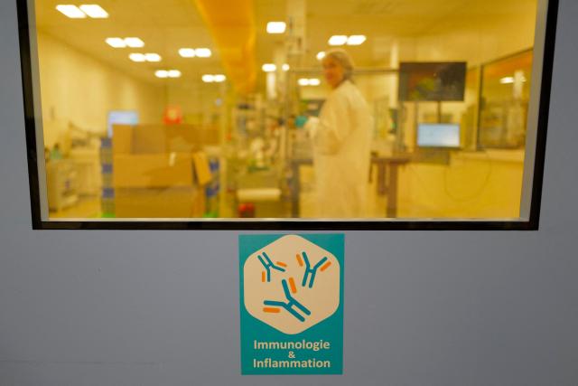An employee works on a production line for clinical trials on a global scale during a press visit to the industrial site of the French pharmaceutical group Sanofi in Montpellier, southern France, on June 16, 2026. (Photo by Sylvain THOMAS / AFP)