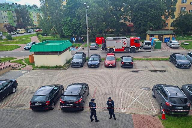 This general view taken on June 16, 2026 shows an area cordoned off by police around a crime scene covered with a tent (back C) in Biala Podlaska, eastern Poland, where Russian artist Semyon Skrepetsky, known for his satirising Russian President Putin has been shot dead. "An investigation is being conducted... into the murder of a 44-year-old citizen of the Russian Federation... known in the media as Semyon Skrepetsky," a spokesman for the prosecutor's office in Lublin, Marcin Kozak, told journalists. Two Belarusian nationals have been arrested in connection with the killing, he added. They were detained in the vicinity of the Belarusian consulate in Biala Podlaska in eastern Poland, where the killing took place. (Photo by Piotr PYRKOSZ / Slowo Podlasia / AFP)