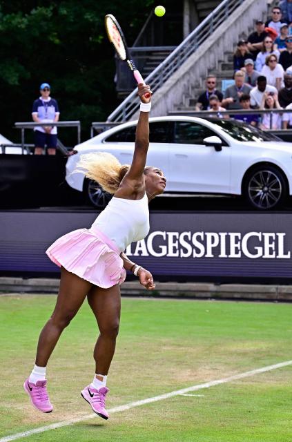 US tennis player Serena Williams serves the ball as she plays with Czech Republic's Karolina Muchova against New Zealand's Erin Routliffe and Mexico's Giuliana Olmos during the women's doubles round of 16 match at the WTA500 Berlin Tennis Open tournament in Berlin on June 16, 2026. (Photo by Tobias SCHWARZ / AFP)