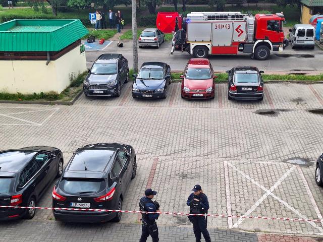 This general view taken on June 16, 2026 shows an area cordoned off by police around a crime scene covered with a tent (back C) near a car park in Biala Podlaska, eastern Poland, where Russian artist Semyon Skrepetsky, known for his satirising Russian President Putin has been shot dead. "An investigation is being conducted... into the murder of a 44-year-old citizen of the Russian Federation... known in the media as Semyon Skrepetsky," a spokesman for the prosecutor's office in Lublin, Marcin Kozak, told journalists. Two Belarusian nationals have been arrested in connection with the killing, he added. They were detained in the vicinity of the Belarusian consulate in Biala Podlaska in eastern Poland, where the killing took place. (Photo by Piotr PYRKOSZ / Slowo Podlasia / AFP)