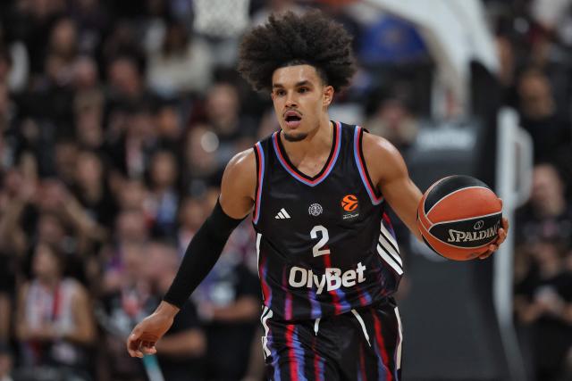 (FILES) Paris Basketball's French-Algerian guard #02 Nadir Hifi runs with the ball during the Euroleague basketball match between Paris Basketball and Virtus Bologna at the Adidas Arena, in Paris, on October 9, 2025. For once, and unlike in recent seasons, the lead roles in the french championship final are being played by Frenchmen: Nadir Hifi has been promoted to starting point guard for Paris Basketball, while Elie Okobo and Matthew Strazel have taken on greater responsibilities at Monaco in the absence of Mike James. The three French internationals will face each other again on June 17, 2026, at the Arena Porte de la Chapelle, for the second game of the final showdown of a season with a distinctly blue-white-red flavour, since only one foreign player made it into the starting five of the regular season. (Photo by Anne-Christine POUJOULAT / AFP)