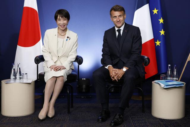 France's President Emmanuel Macron (R) and Japan's Prime Minister Sanae Takaichi (L) attend a bilateral meeting on the sideline of the G7 summit, in Evian, eastern France, on June 16, 2026. A G7 summit is set to take place June 15 to 17 in the French town of Evian-les-Bains near Switzerland and it will be attended by country leaders as well as the EU's foreign policy chief and ministers from Brazil, Canada, the United Arab Emirates and Turkey. (Photo by Yoan VALAT / POOL / AFP)
