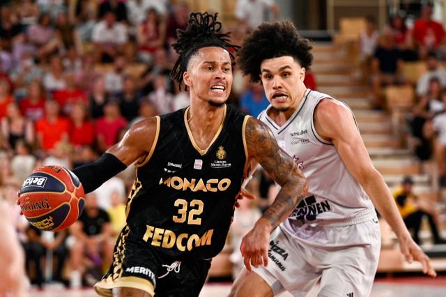 (FILES) Monaco's French point guard #32 Matthew Strazel (L) dribbles past Paris' French guard Nadir Hifi during the French Elite Championship Final Game 4 basketball match between AS Monaco and Paris Basketball at the Salle Gaston Medecin, in Monaco, on June 22, 2025. For once, and unlike in recent seasons, the lead roles in the french championship final are being played by Frenchmen: Nadir Hifi has been promoted to starting point guard for Paris Basketball, while Elie Okobo and Matthew Strazel have taken on greater responsibilities at Monaco in the absence of Mike James. The three French internationals will face each other again on June 17, 2026, at the Arena Porte de la Chapelle, for the second game of the final showdown of a season with a distinctly blue-white-red flavour, since only one foreign player made it into the starting five of the regular season. (Photo by Frederic DIDES / AFP)