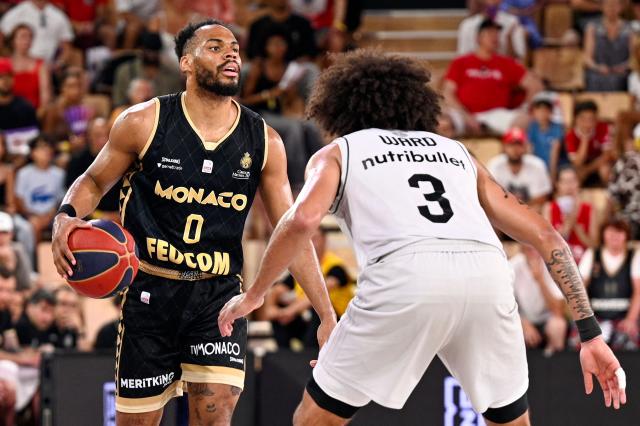 (FILES) Monaco's French Guard #0 Elie Okobo dribbles during the French Elite Championship Final Game 4 basketball match between AS Monaco and Paris Basketball at the Salle Gaston Medecin, in Monaco, on June 22, 2025. For once, and unlike in recent seasons, the lead roles in the french championship final are being played by Frenchmen: Nadir Hifi has been promoted to starting point guard for Paris Basketball, while Elie Okobo and Matthew Strazel have taken on greater responsibilities at Monaco in the absence of Mike James. The three French internationals will face each other again on June 17, 2026, at the Arena Porte de la Chapelle, for the second game of the final showdown of a season with a distinctly blue-white-red flavour, since only one foreign player made it into the starting five of the regular season. (Photo by Frederic DIDES / AFP)