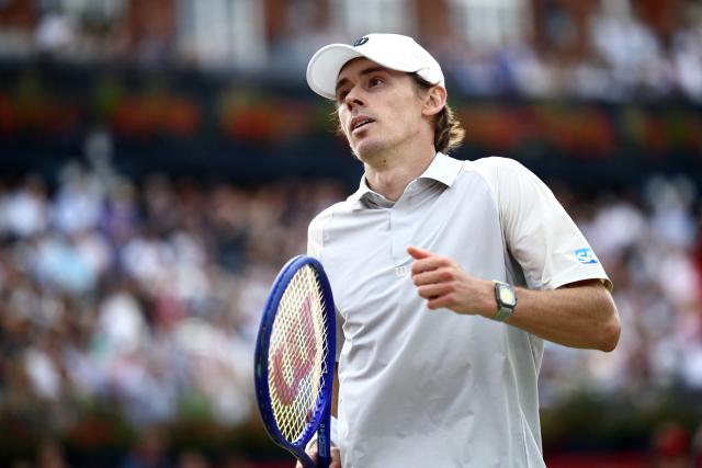Australia's Alex de Minaur looks on during his match with Canada's Gabriel Diallo during their men's singles round of 32 tennis match on day two of the ATP HSBC Championships at Queen's Club in west London on June 16, 2026. (Photo by Henry NICHOLLS / AFP)