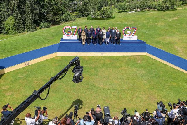 (From L) European Council President Antonio Costa, Italy's Prime Minister Giorgia Meloni, South Korea's President Lee Jae-myung, Egypt's President Abdel Fattah El-Sisi, Britain's Prime Minister Keir Starmer, US President Donald Trump, Kenya's President William Ruto, France's President Emmanuel Macron, Japan's Prime Minister Sanae Takaichi, India's Prime Minister Narendra Modi, Canada's Prime Minister Mark Carney, Germany's Chancellor Friedrich Merz, European Commission President Ursula von der Leyen and BBrazil's President Luiz Inacio Lula da Silva pose for a family photograph during the G7 summit, in Evian, eastern France, on June 16, 2026. A G7 summit is set to take place June 15 to 17 in the French town of Evian-les-Bains near Switzerland and it will be attended by country leaders as well as the EU's foreign policy chief and ministers from Brazil, Canada, the United Arab Emirates and Turkey. (Photo by Dominique JACOVIDES / POOL / AFP)