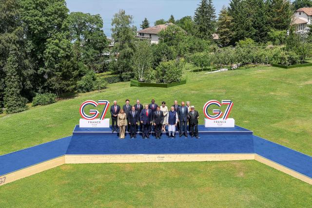 (From L) European Council President Antonio Costa, Italy's Prime Minister Giorgia Meloni, South Korea's President Lee Jae-myung, Egypt's President Abdel Fattah El-Sisi, Britain's Prime Minister Keir Starmer, US President Donald Trump, Kenya's President William Ruto, France's President Emmanuel Macron, Japan's Prime Minister Sanae Takaichi, India's Prime Minister Narendra Modi, Canada's Prime Minister Mark Carney, Germany's Chancellor Friedrich Merz, European Commission President Ursula von der Leyen and BBrazil's President Luiz Inacio Lula da Silva pose for a family photograph during the G7 summit, in Evian, eastern France, on June 16, 2026. A G7 summit is set to take place June 15 to 17 in the French town of Evian-les-Bains near Switzerland and it will be attended by country leaders as well as the EU's foreign policy chief and ministers from Brazil, Canada, the United Arab Emirates and Turkey. (Photo by Dominique JACOVIDES / POOL / AFP)