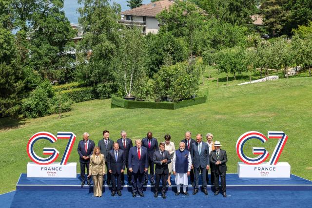 (From L) European Council President Antonio Costa, Italy's Prime Minister Giorgia Meloni, South Korea's President Lee Jae-myung, Egypt's President Abdel Fattah El-Sisi, Britain's Prime Minister Keir Starmer, US President Donald Trump, Kenya's President William Ruto, France's President Emmanuel Macron, Japan's Prime Minister Sanae Takaichi, India's Prime Minister Narendra Modi, Canada's Prime Minister Mark Carney, Germany's Chancellor Friedrich Merz, European Commission President Ursula von der Leyen and BBrazil's President Luiz Inacio Lula da Silva pose for a family photograph during the G7 summit, in Evian, eastern France, on June 16, 2026. A G7 summit is set to take place June 15 to 17 in the French town of Evian-les-Bains near Switzerland and it will be attended by country leaders as well as the EU's foreign policy chief and ministers from Brazil, Canada, the United Arab Emirates and Turkey. (Photo by Dominique JACOVIDES / POOL / AFP)