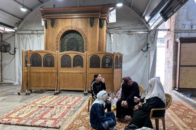 Palestinian women gather to celebrate the Islamic Hijri New Year at the Ibrahimi Mosque, known to Jews as the Cave of the Patriarchs, located inside the Israeli-controlled H2 sector of the occupied West Bank city of Hebron, on June 16, 2026. Israel's finance minister said on June 16, he had stripped Palestinians of authority over the site of the Cave of Patriarchs, known to Muslims as the Ibrahimi Mosque, in the occupied West Bank. The move to transfer management of the site to an Israeli committee controlled by the far-right minister, drew swift condemnation from the Palestinian Authority. (Photo by Hazem BADER / AFP)