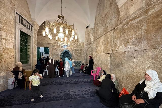 Palestinian women gather to celebrate the Islamic Hijri New Year at the Ibrahimi Mosque, known to Jews as the Cave of the Patriarchs, located inside the Israeli-controlled H2 sector of the occupied West Bank city of Hebron, on June 16, 2026. Israel's finance minister said on June 16, he had stripped Palestinians of authority over the site of the Cave of Patriarchs, known to Muslims as the Ibrahimi Mosque, in the occupied West Bank. The move to transfer management of the site to an Israeli committee controlled by the far-right minister, drew swift condemnation from the Palestinian Authority. (Photo by Hazem BADER / AFP)