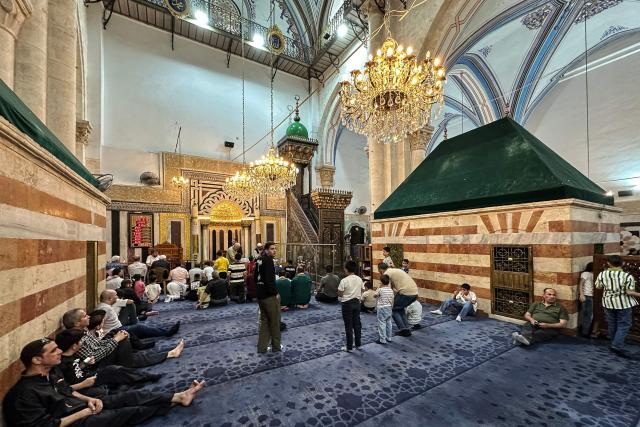 Palestinians gather to celebrate the Islamic Hijri New Year at the Ibrahimi Mosque, known to Jews as the Cave of the Patriarchs, located inside the Israeli-controlled H2 sector of the occupied West Bank city of Hebron, on June 16, 2026. Israel's finance minister said on June 16, he had stripped Palestinians of authority over the site of the Cave of Patriarchs, known to Muslims as the Ibrahimi Mosque, in the occupied West Bank. The move to transfer management of the site to an Israeli committee controlled by the far-right minister, drew swift condemnation from the Palestinian Authority. (Photo by Hazem BADER / AFP)